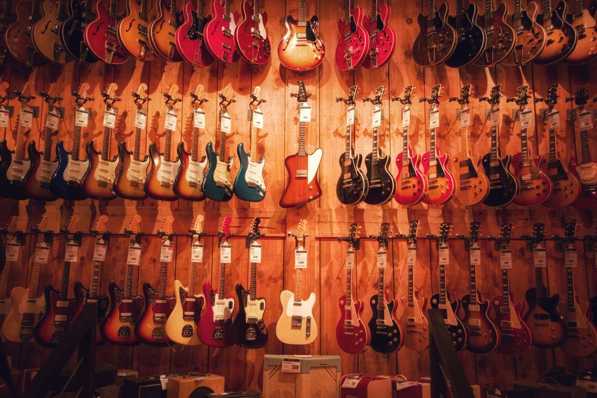Original OCDIR directory artwork for Fullerton Guitar Works — not a business photograph